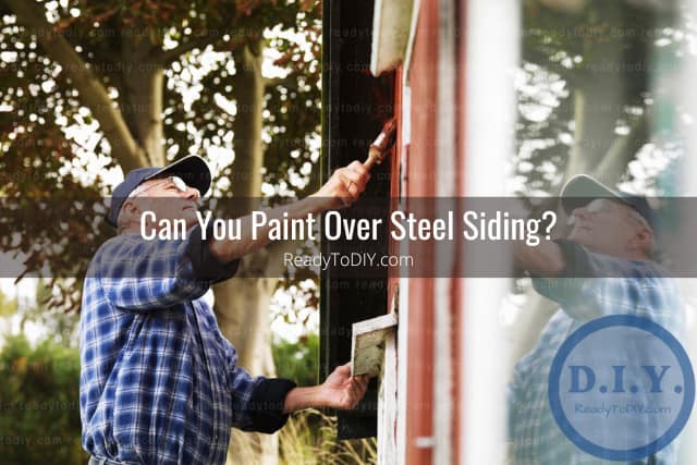 Painting the steel siding of the house