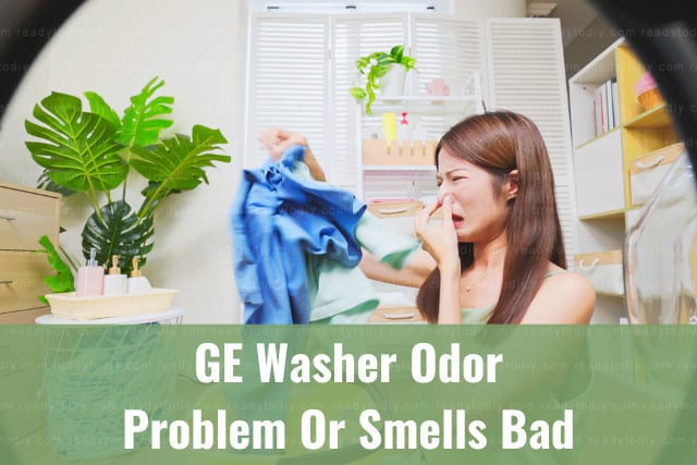 Woman holding clothes with bad smell