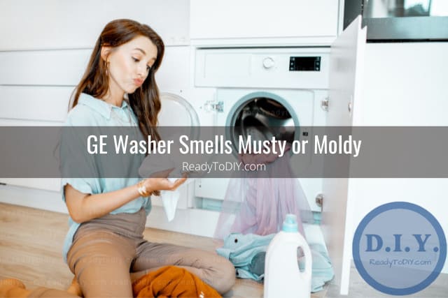 Woman holding clothes with bad smell