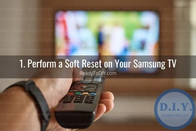 Holding a remote while point at the tv