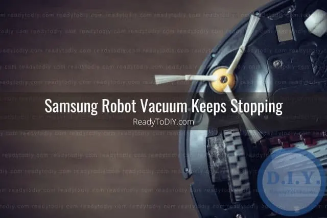 Robot vacuum flipped over revealing brushes