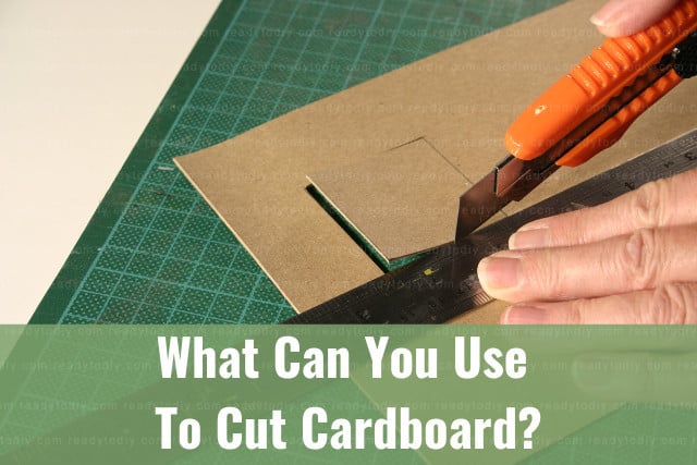 Cutting the cardboard using cutter