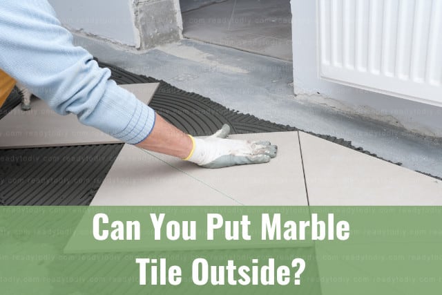 Man installing the marble tile