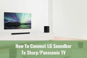 Black soundbar below the flatscreen tv
