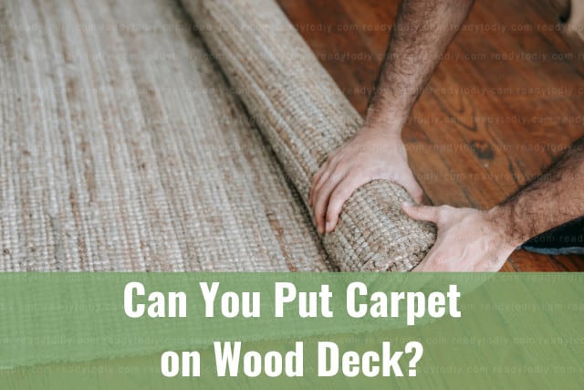 man installing carpet in wood deck