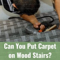 Man installing carpet in wood stairs