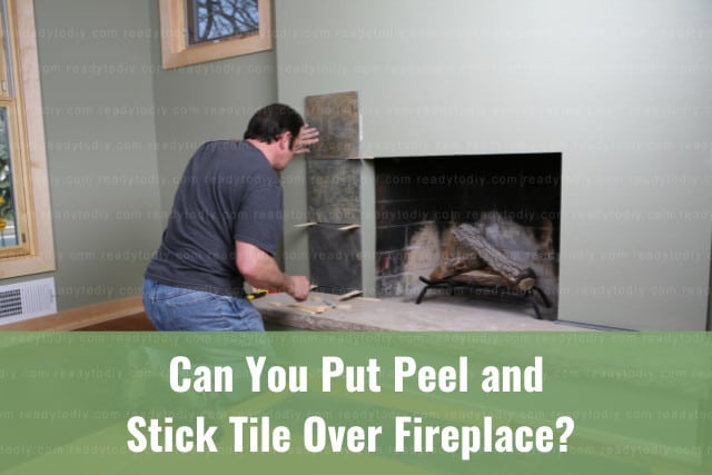man putting tile on the fireplace