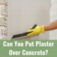 man putting cement in concrete