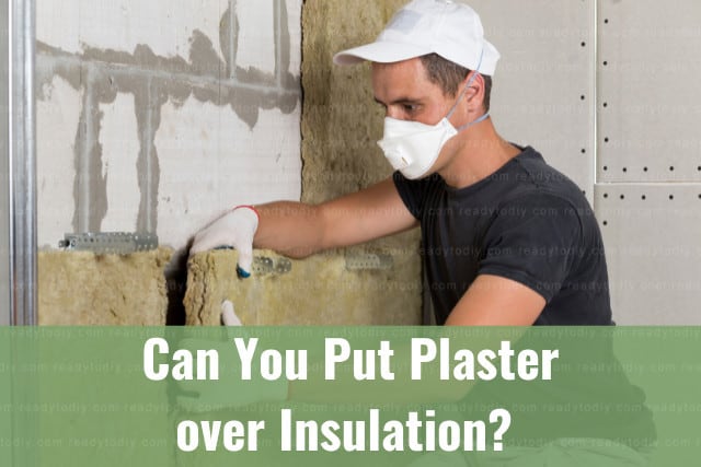 Man putting insulation on the wall
