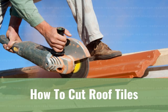 Man cutting roof tiles