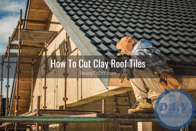 Man cutting roof tiles