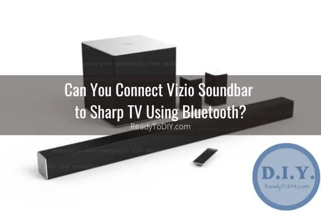 Black soundbar below the flatscreen tv