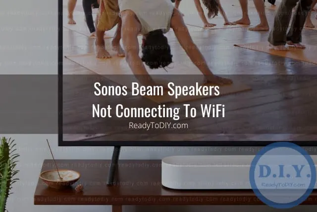 White latest speaker below flatscreen tv