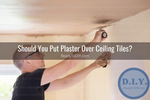 Man putting plaster on the ceiling