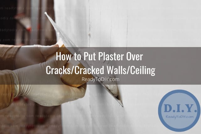 Man putting plaster on the wall