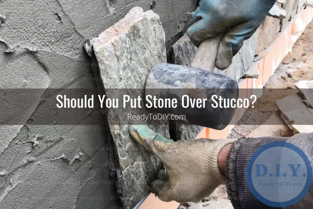 Putting stone on the wall