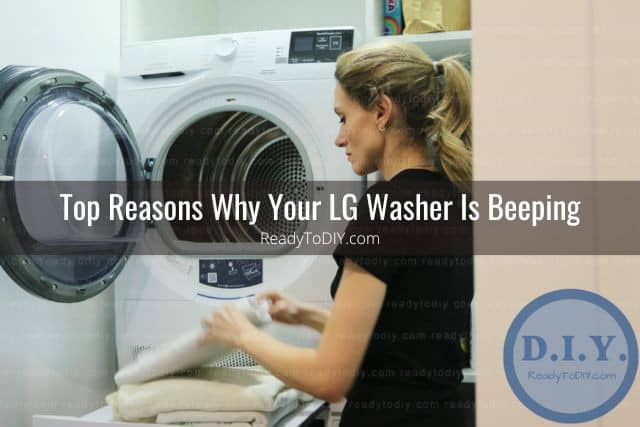 Woman folding towels in front of washing machine