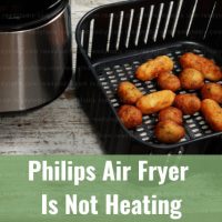Modern air fryer in the kitchen with food inside