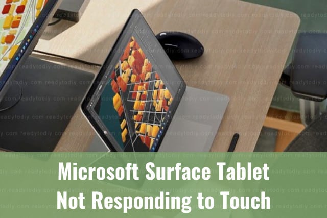 Black microsoft surface tablet on the table