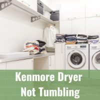 White dryer machine with clothes