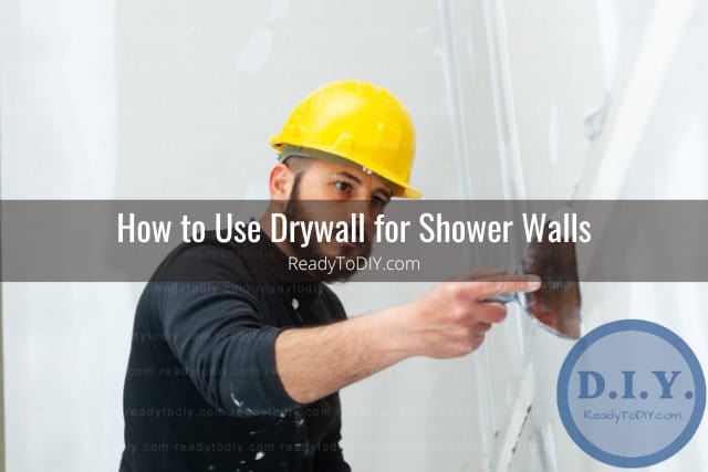 Man putting drywall